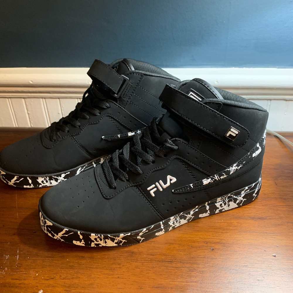 Men’s black and white Fila High Tops